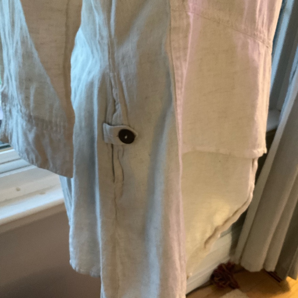 Asymmetrical boutique top with button accent